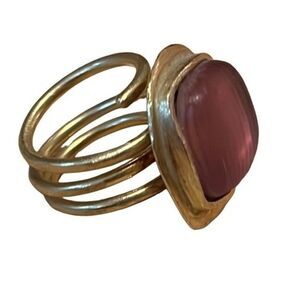costume jewelry ring. Brushed Gold Tone Metal hand crafted metal with pink stone